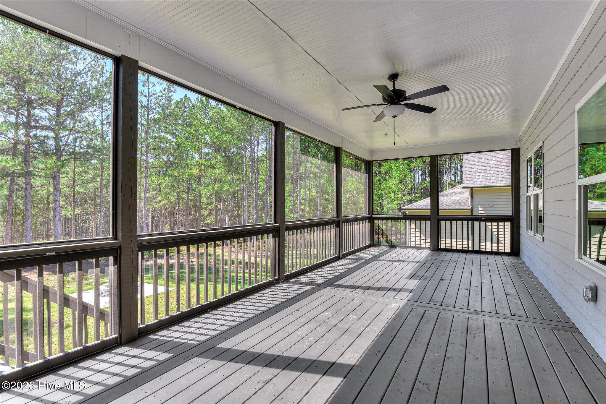 Screened porch stretches across the back of the home.