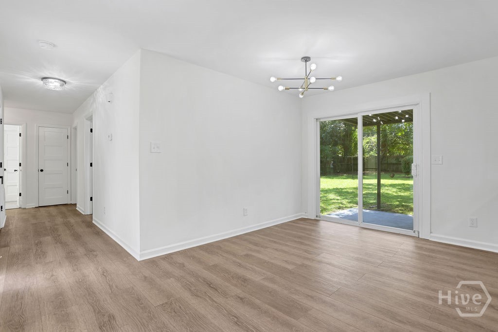 Hallway leads to 3 bedrooms and 1.5 bathrooms