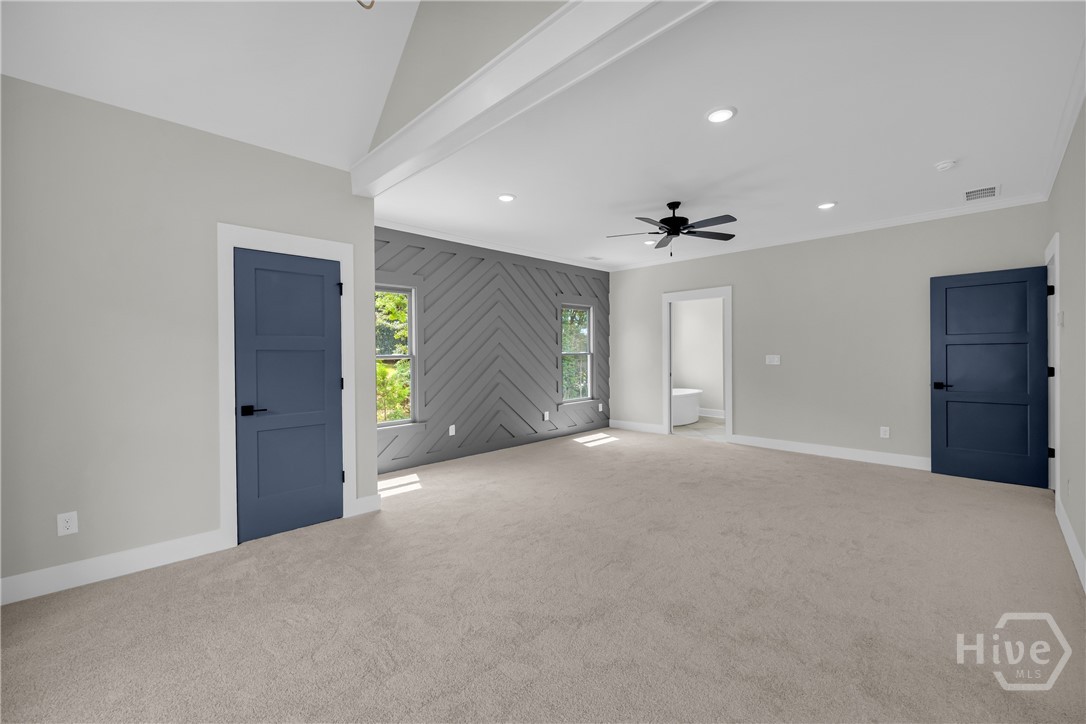 The spectacular owner’s retreat is a destination of its own, complete with a designer accent wall, private sitting area, pocket doors leading to a spa-inspired bath, and a unique secret passageway that adds a touch of charm and character you won’t find elsewhere.