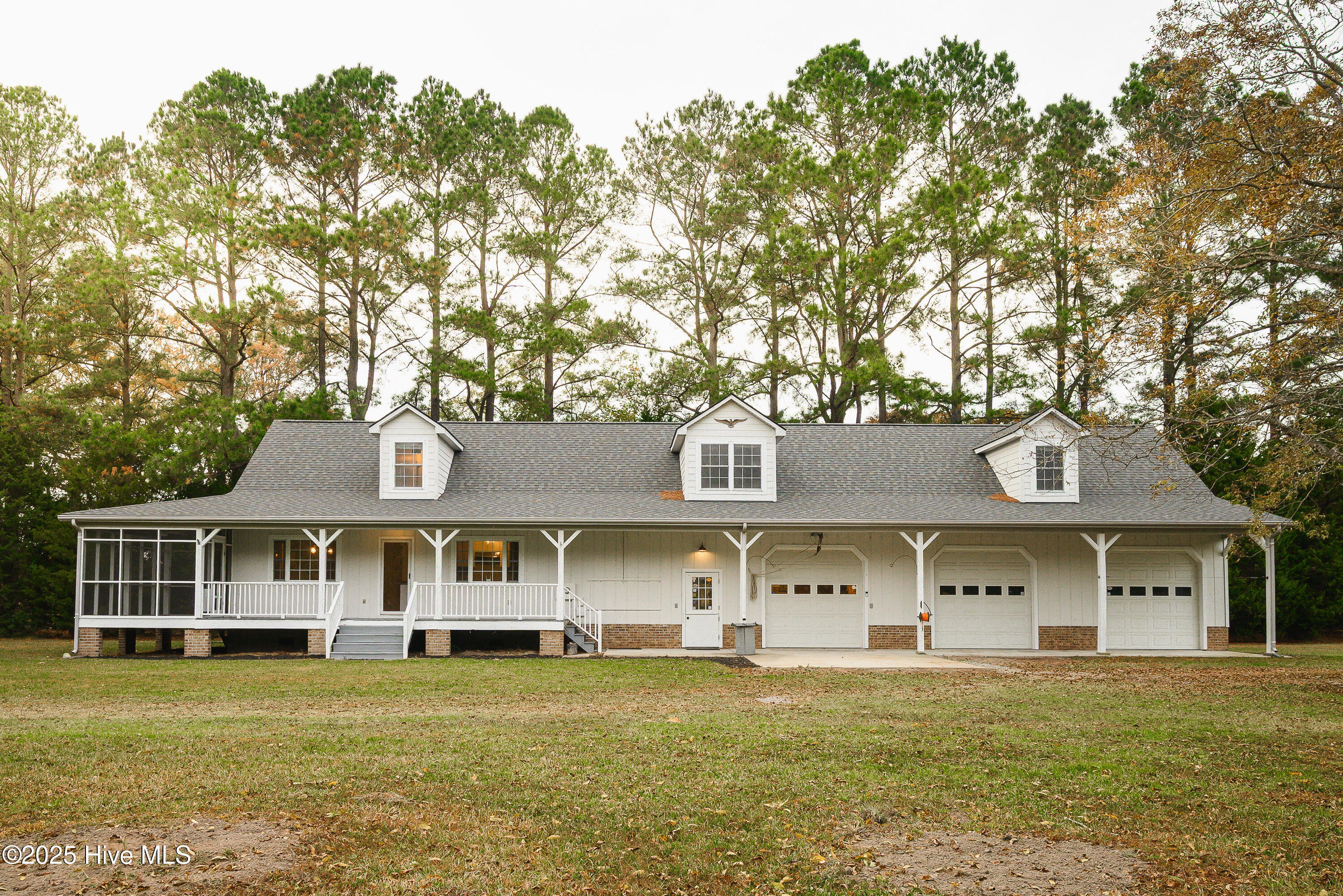 Secondary Dwelling with 3 door garage and cozy brick fire place and bar area.