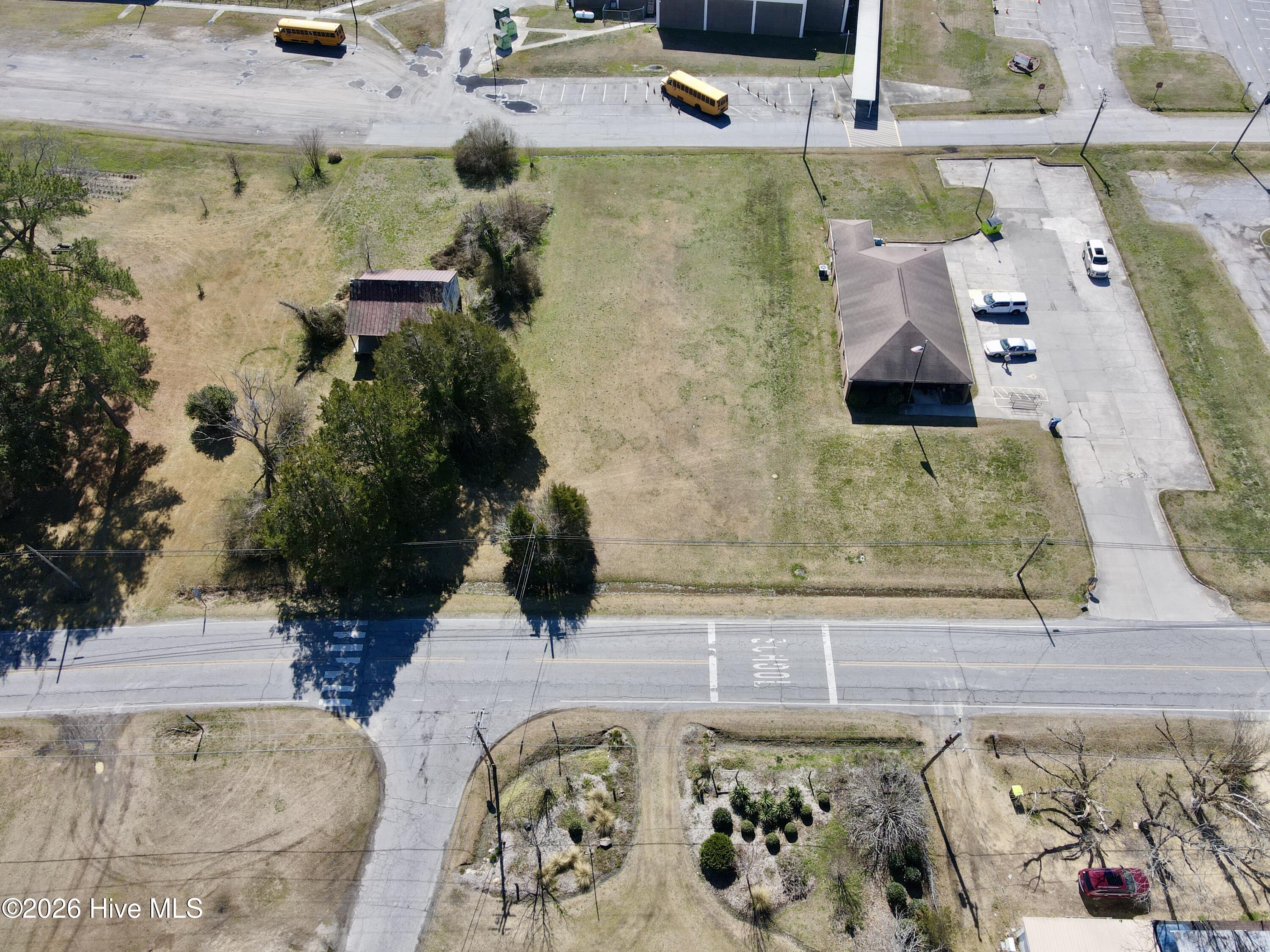 Now available -- a prime commercial opportunity in the heart of Jamesville! This cleared and level vacant lot is ready for your next business venture. With a grassy, build-ready landscape, you can move straight into the planning and development phase without the hassle of extensive site preparation.Strategically located next to the local school, this property offers excellent visibility and steady daily traffic, making it an ideal spot for a variety of commercial uses. City water and city sewer are available, adding even more convenience and value to this investment opportunity.Whether you're looking to expand your portfolio or launch a new business in a growing community, this lot checks all the boxes. Opportunities like this don't last long -- secure your spot in Jamesville today before it's gone!