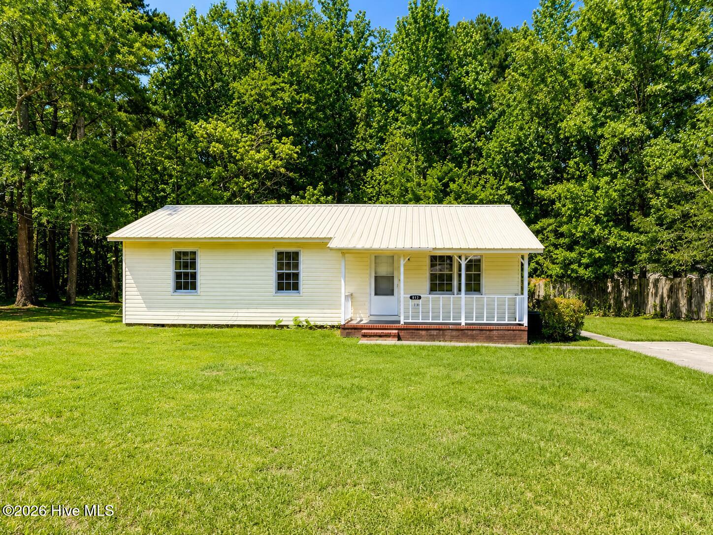 Move in ready 3 Bedroom 2 full bath with a covered front porch and shady back yard. Close to town and amenities, this home sits on a quiet street that feels tucked away and private.