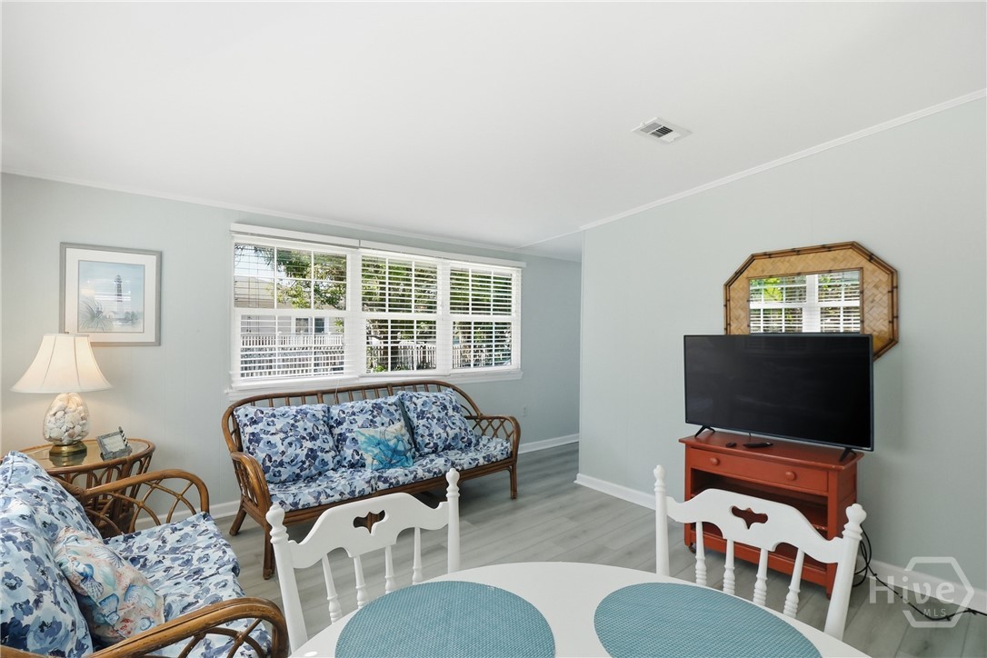 CLOSE TO KITCHEN, SURE TO BE A POPULAR HANG-OUT.
