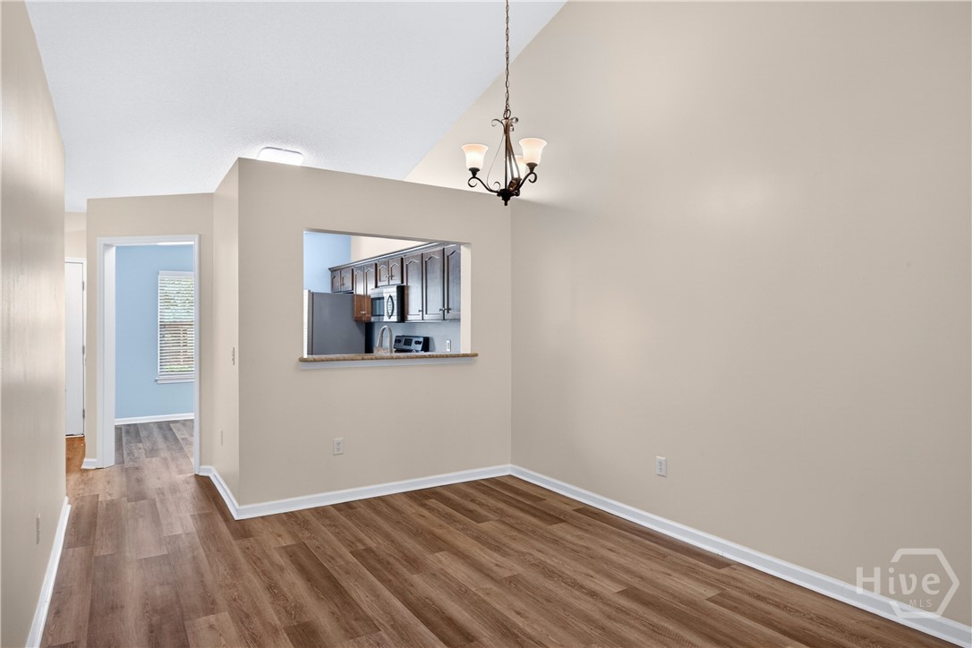 In the living room with the porch entry at your back