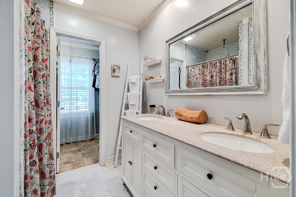 Primary bath with double vanaties, walk in shower. Washer and Dryer are also located in the closet.