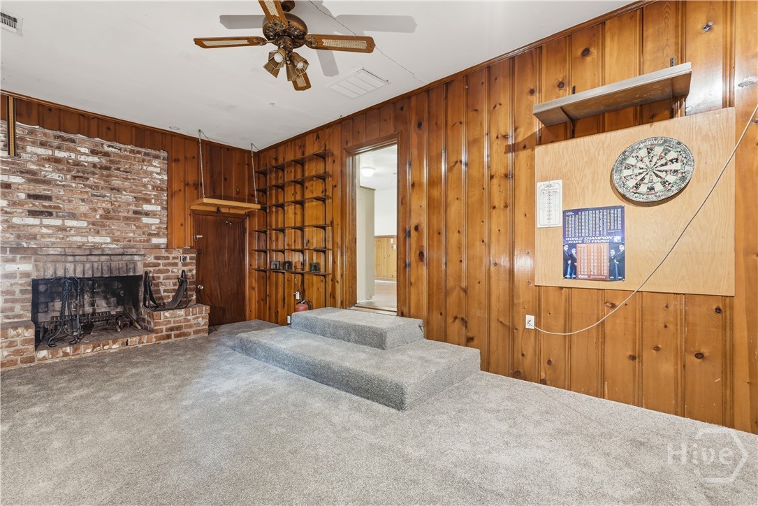 Family or game room with fireplace