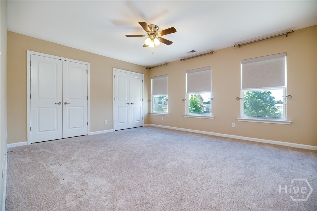 Bedroom #2 (largest of the 3 secondary bedroom) Loads of natural light and custom Roman shades