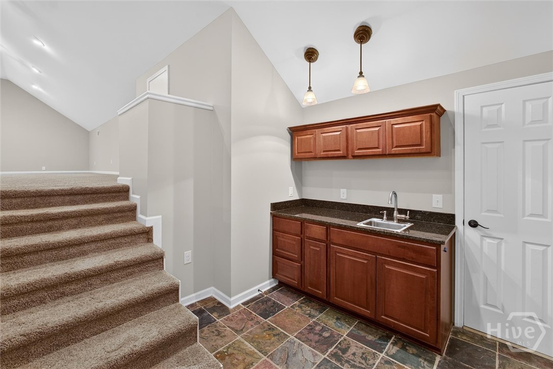 Upstairs wet bar, expansive bonus room up the stairs