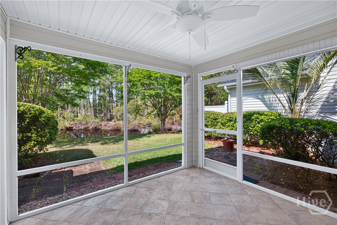 On the porch with the entry door behind and to your right