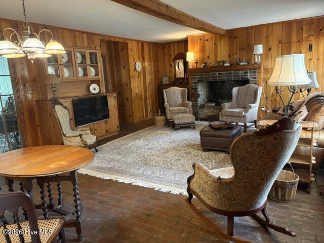 This den! Brick floor, cozy fireplace- so warm and inviting-- use your imagination or consult AI to view a brightened up space with paint
