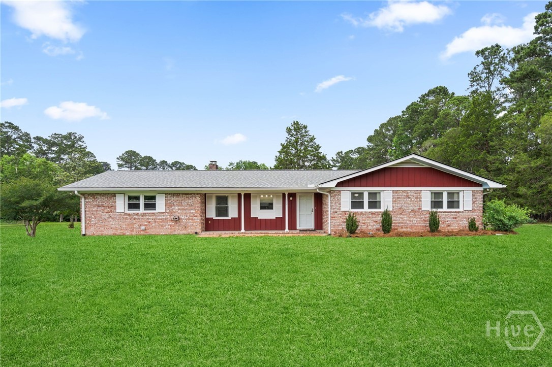 Don't let the square footage fool you!  This all-brick ranch in Rincon is packed with potential! Sitting on 5 full acres, this home lives comfortably now but offers a rare opportunity to expand with ease. The 24x20 garage is already insulated, pre-plumbed for a full bath, and supported by an HVAC system sized to handle the additional space, making a future master suite conversion simple and cost-effective. Inside, you'll find laminate flooring throughout, a cozy Buck stove with brick surround, and a floored attic for storage. Big-ticket items are already taken care of with a brand new 50-year roof, new well pump and updated septic system with new drain field. Solid construction, smart upgrades, and built-in equity potential all in a great location! Exterior photos of front of house have been digitally enhanced.