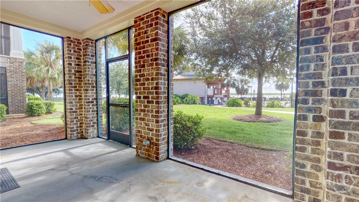 Screened in back patio is steps away to the fitness center, pool, and the river.