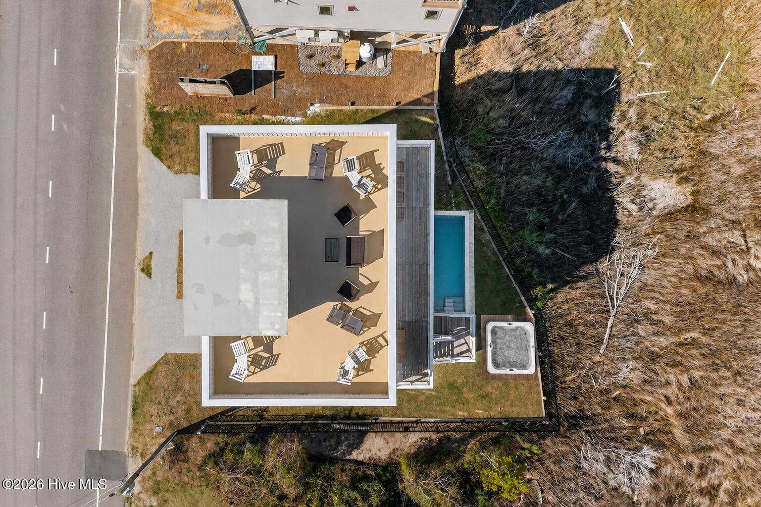 Backyard inspiration Mockup provided by AI generation software. Possible space to add a small plunge pool. Home does not include pool