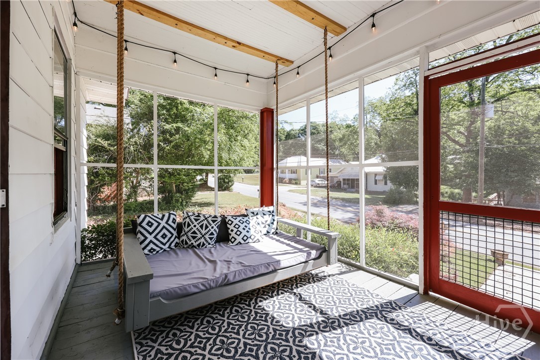 Front screened porch with bed swing