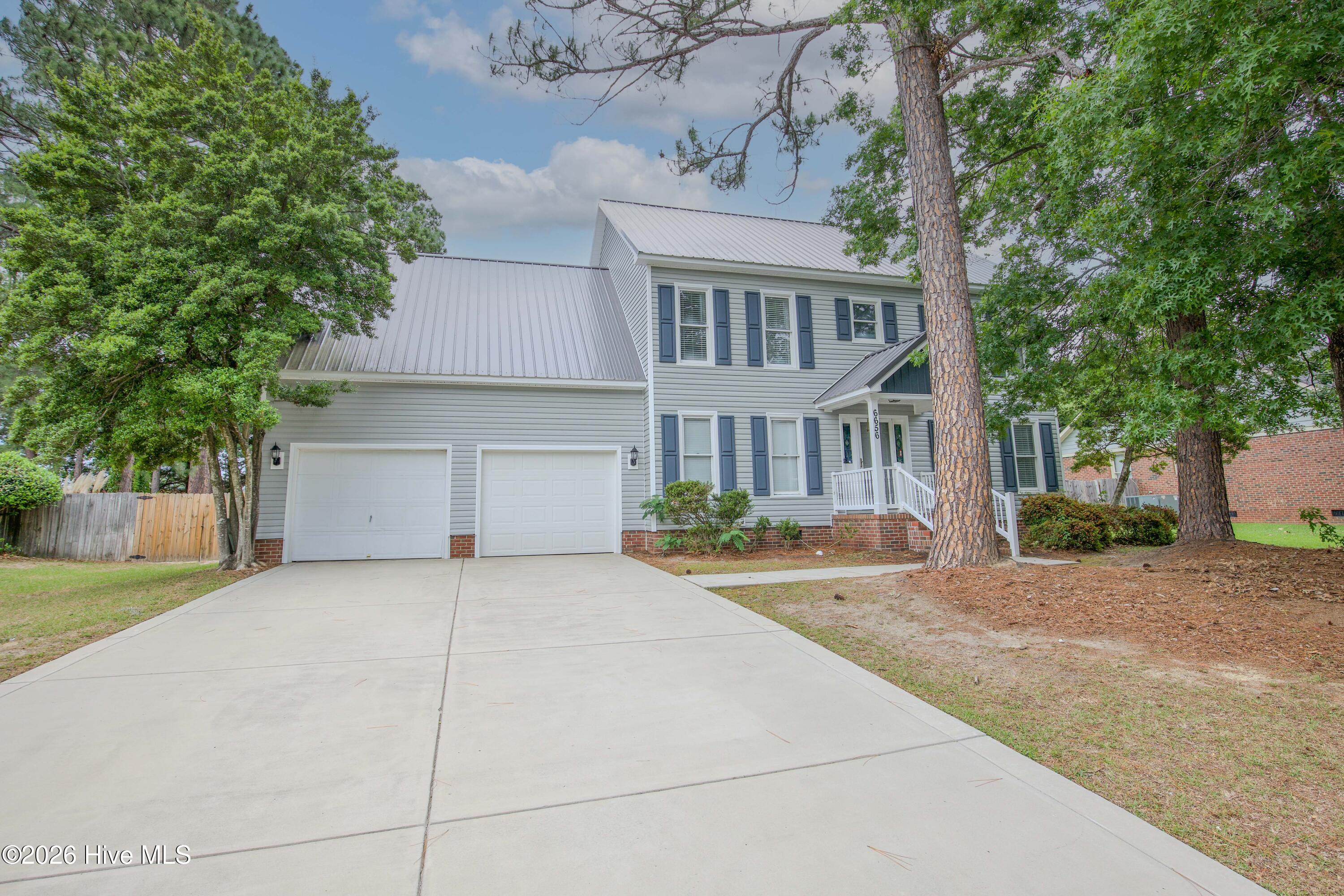 Beautiful two-story home located in the established Wells Place community of Fayetteville, NC featuring timeless curb appeal, mature trees, professional landscaping, and a spacious two-car garage. Conveniently located near Fort Bragg, Raeford Road, shopping, dining, schools, and the Fayetteville VA Health Care Center. This well-maintained property offers no HOA restrictions, making it an excellent option for buyers seeking flexibility, outdoor space, and a convenient commute to Fort Bragg and surrounding military facilities. Ideal for military relocation, PCS buyers, VA buyers, and anyone searching for a move-in ready Fayetteville home with character and space.
