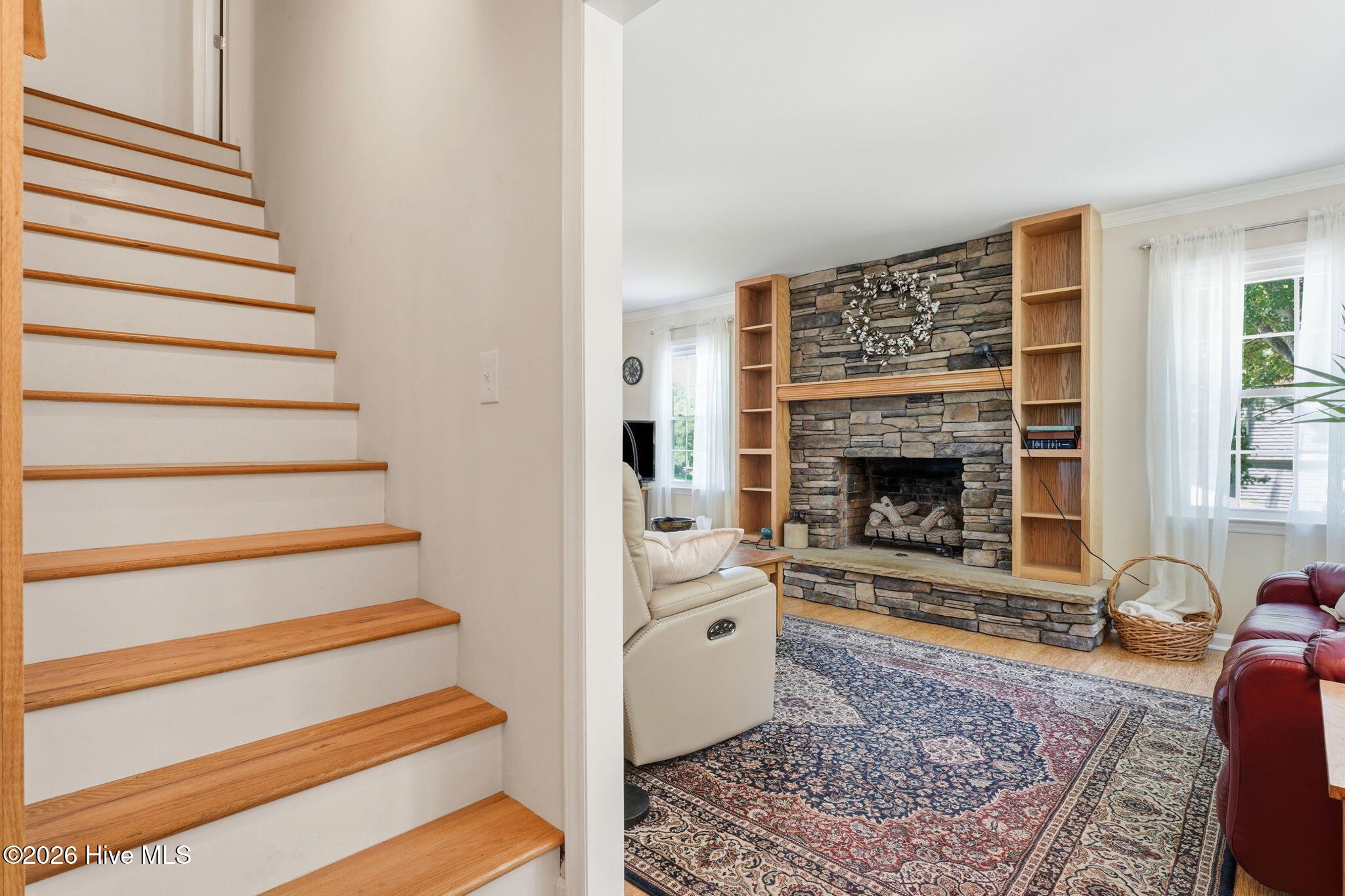 To the right is the living area. Up the stairs to the 2nd and 3rd bedrooms.