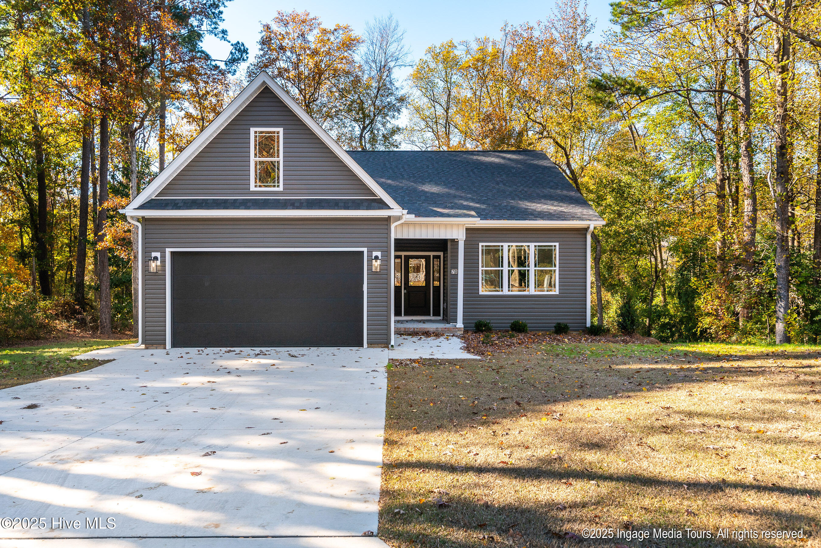 708 Lancelot Drive Greenville, North Carolina There's something special about 708 Lancelot Drive — a sense of welcome you can feel before you even step inside. The home sits quietly among mature trees, where sunlight filters through the branches and the air feels just a bit calmer.Inside, custom craftsmanship takes center stage — from wide crown mouldings to solid-wood closets and thoughtful trim that speaks to quality. The open layout flows easily from the kitchen to the living and dining areas, making it ideal for gatherings or quiet evenings at home. The kitchen offers both beauty and function with its spacious pantry and warm, inviting design.A bonus room provides space for whatever life calls for — an office, a playroom, or a cozy retreat. Step out onto the covered rear deck and take in the peaceful view of the wooded lot, a perfect place to begin your morning or unwind at the end of the day.With three bedrooms, two full baths, and a two-car garage, this home blends character, comfort, and connection — the kind of place where lasting memories are made. Extra under-home storage makes this a truly unique place to call 'home'.