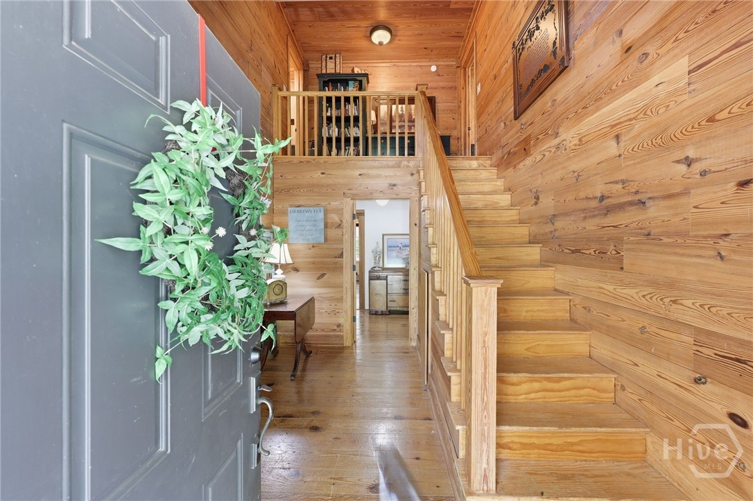 Vaulted entry with pine finishes & staircase to period