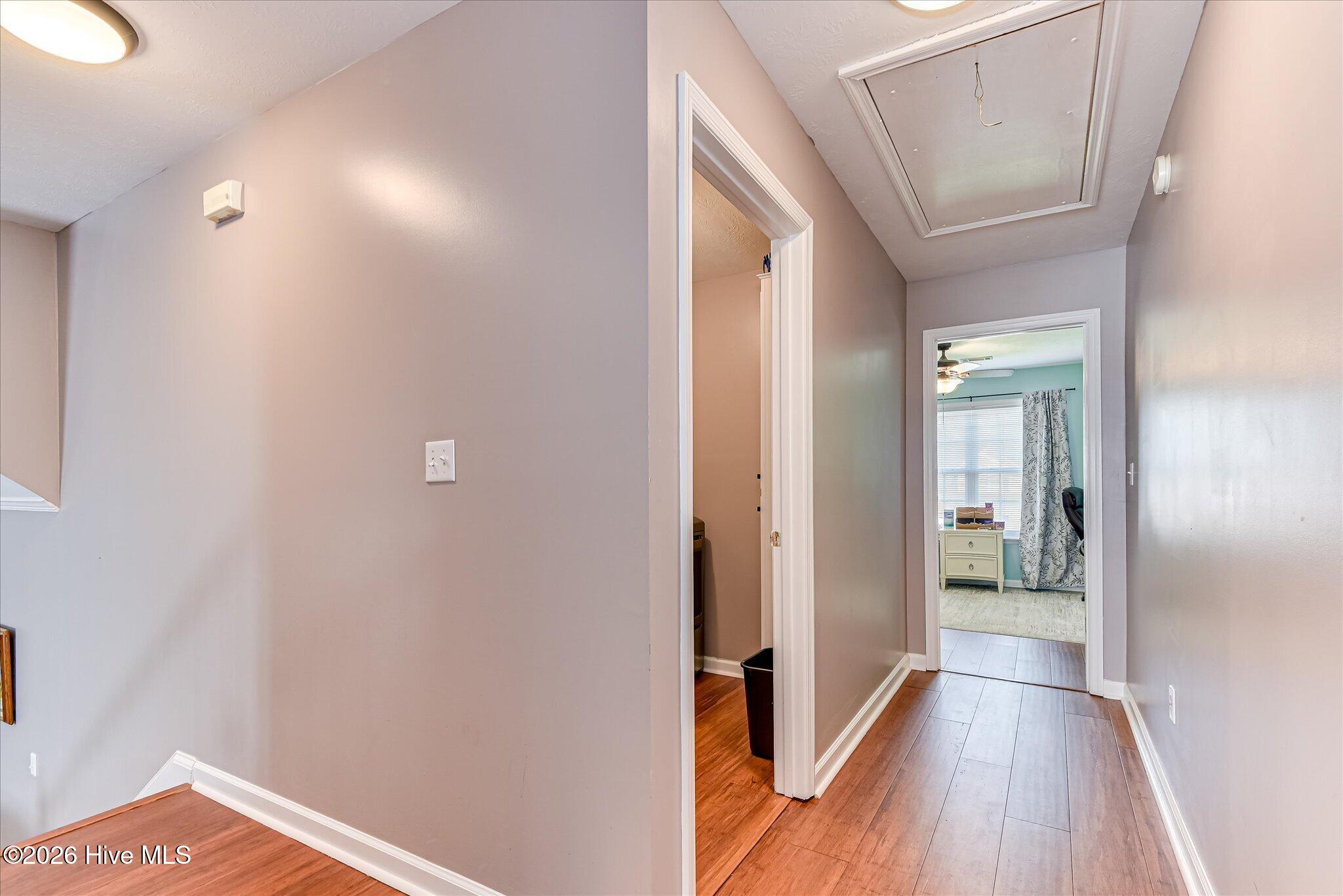 half flight stairs to main floor from primary bedrooms