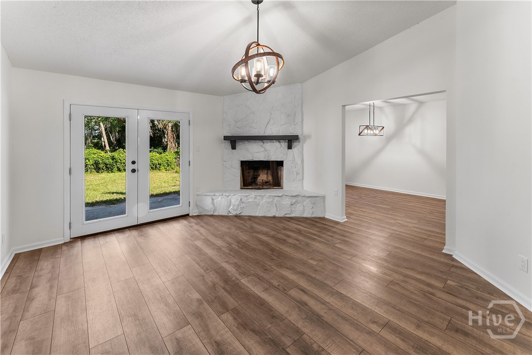 Fireplace and doors leading to back yard.