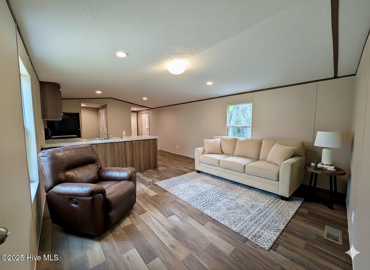 612 Bayshore Drive SE, Bolivia, NC 28422 – photo 4: Living room with AI added furniture