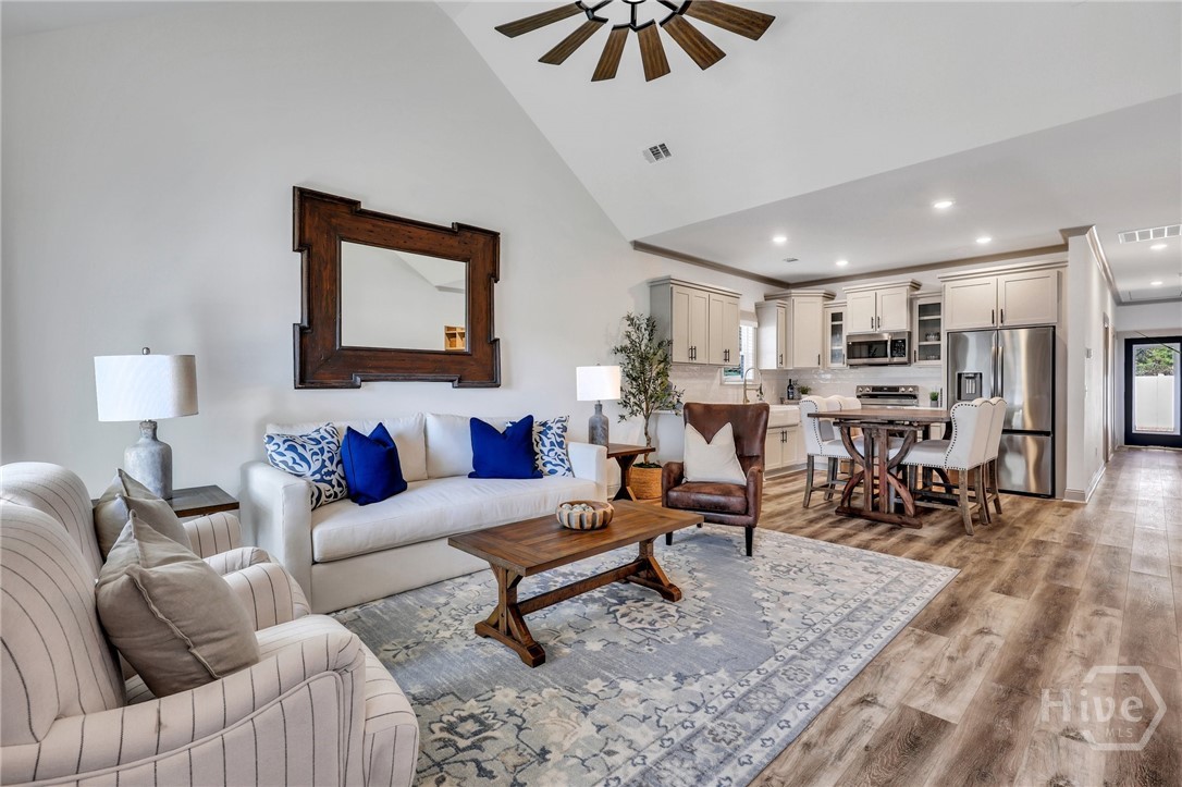 PHOTOS OF A PREVIOUSLY BUILT BRINSON PLAN BY LAWRENCE ALEXANDER HOMES.