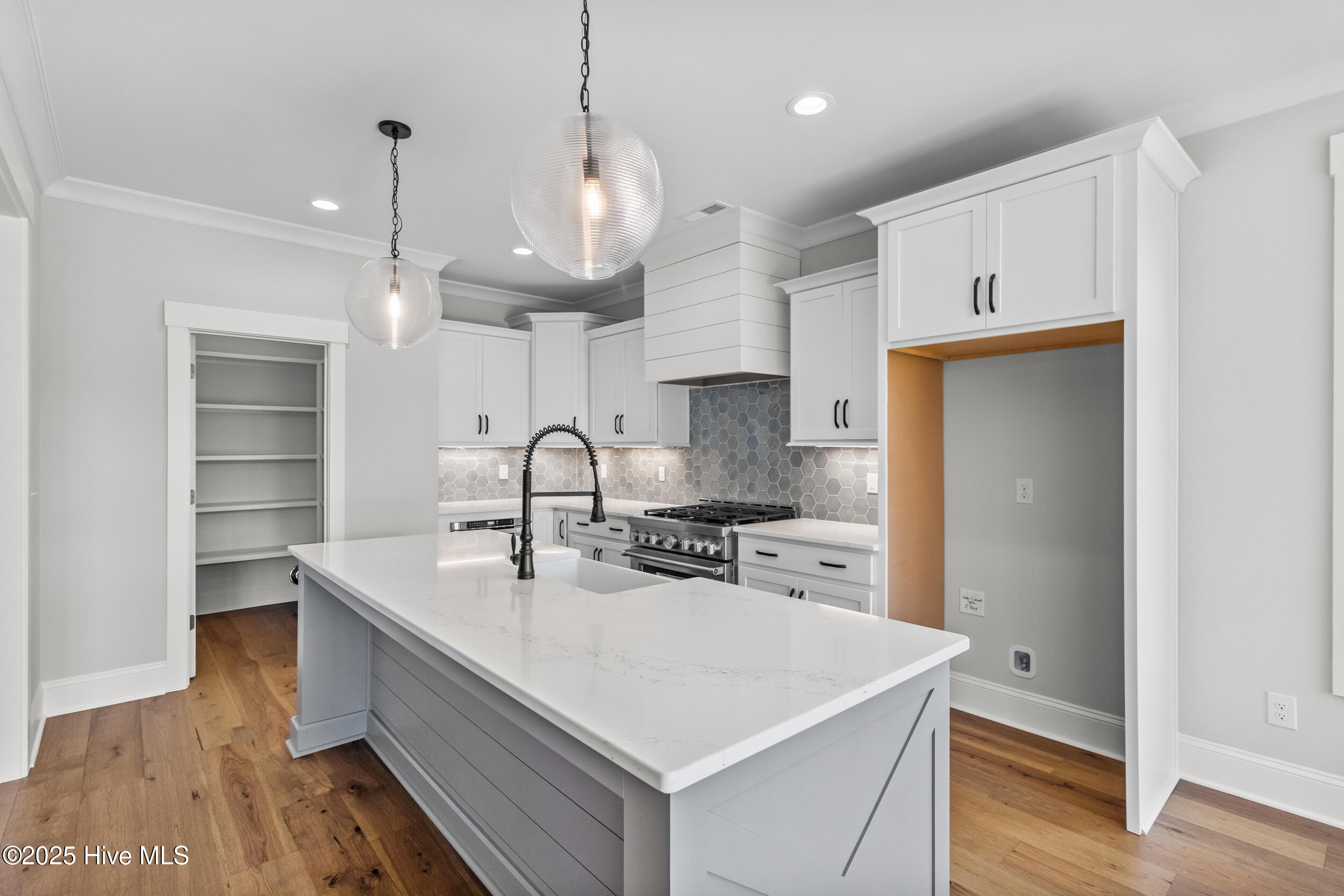 Kitchen with large island, sink, and extra space for seating