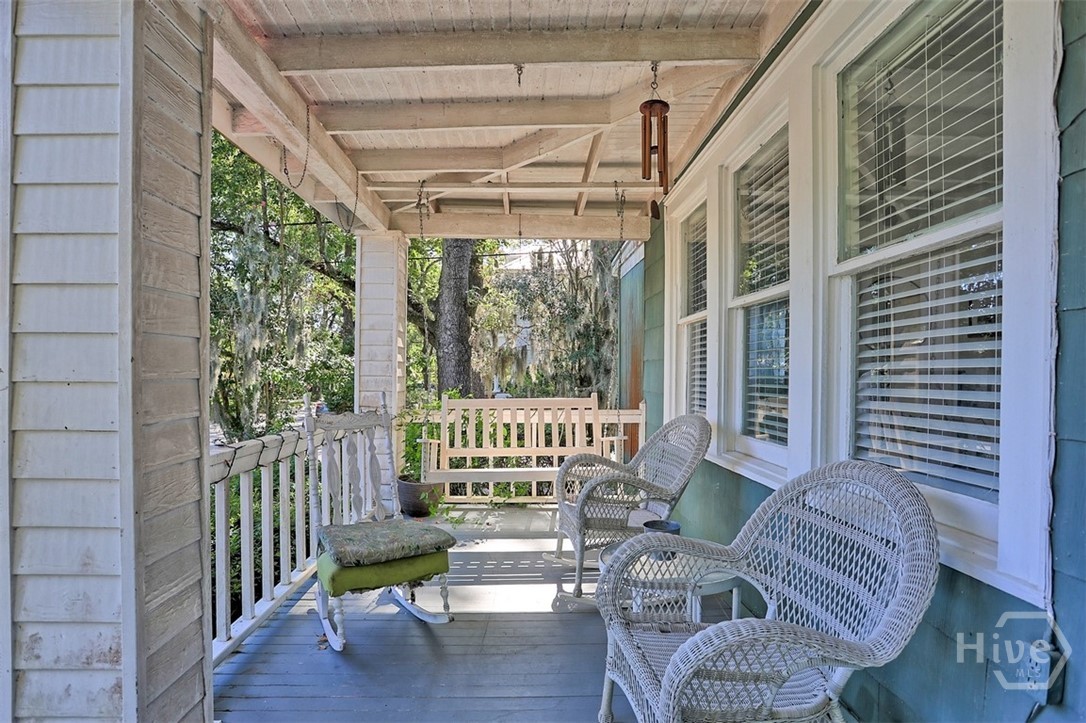 Main home - spacious front porch to enjoy!