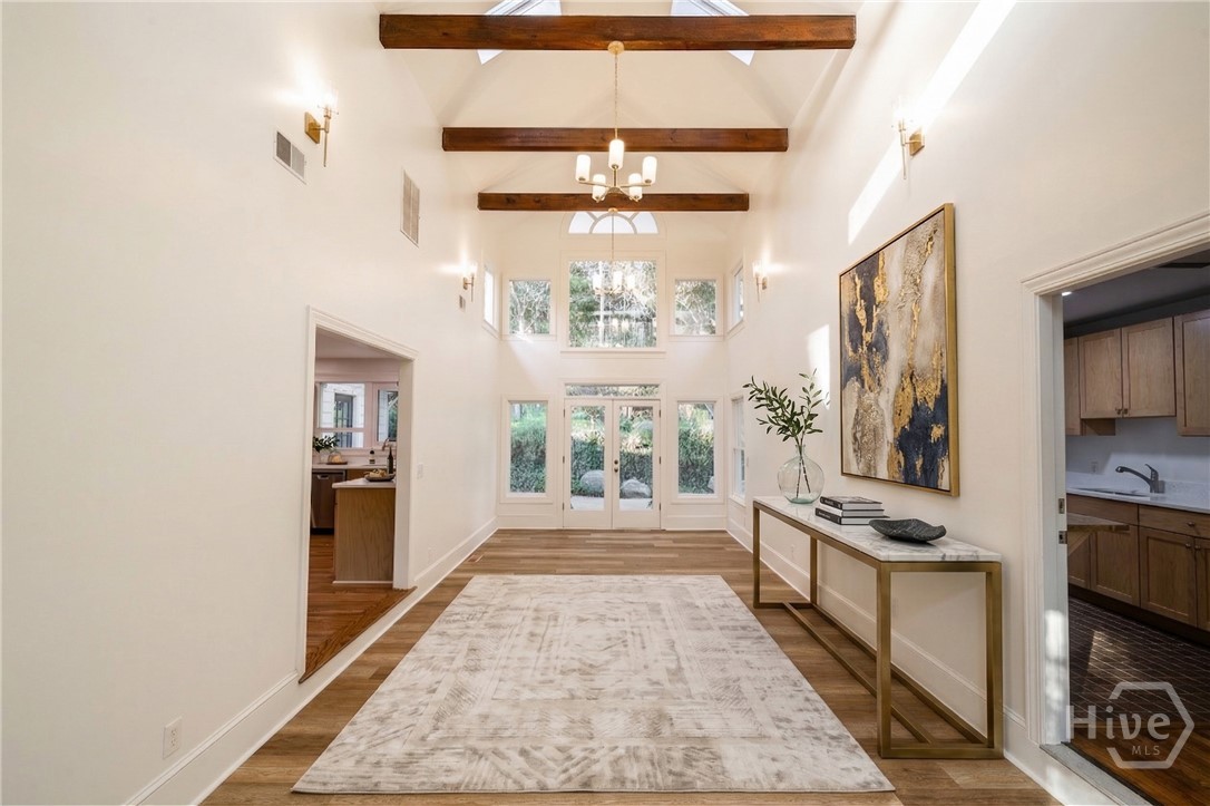 Virtually staged foyer/sunroom