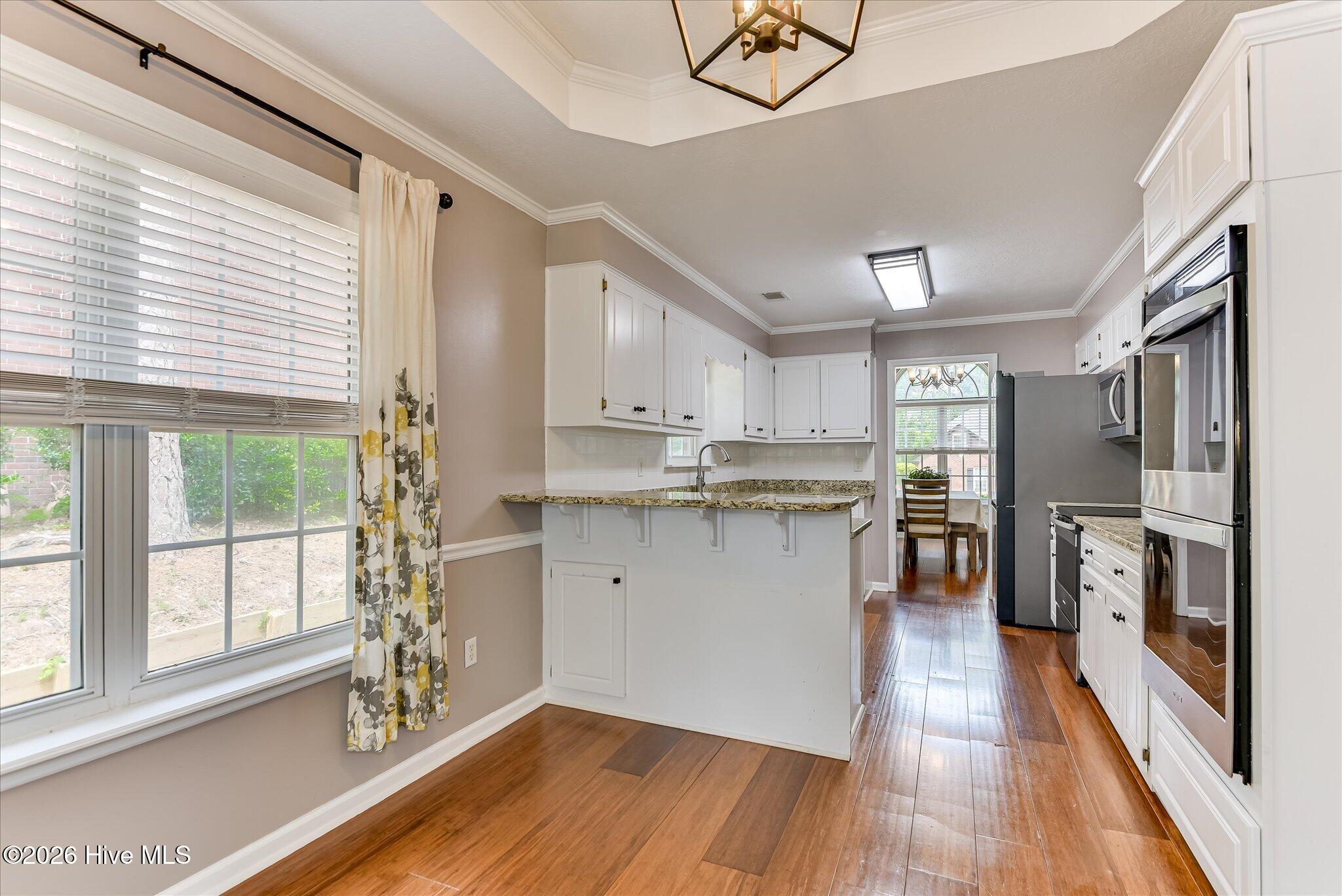 Kitchen also has the same Beautiful wood floors!