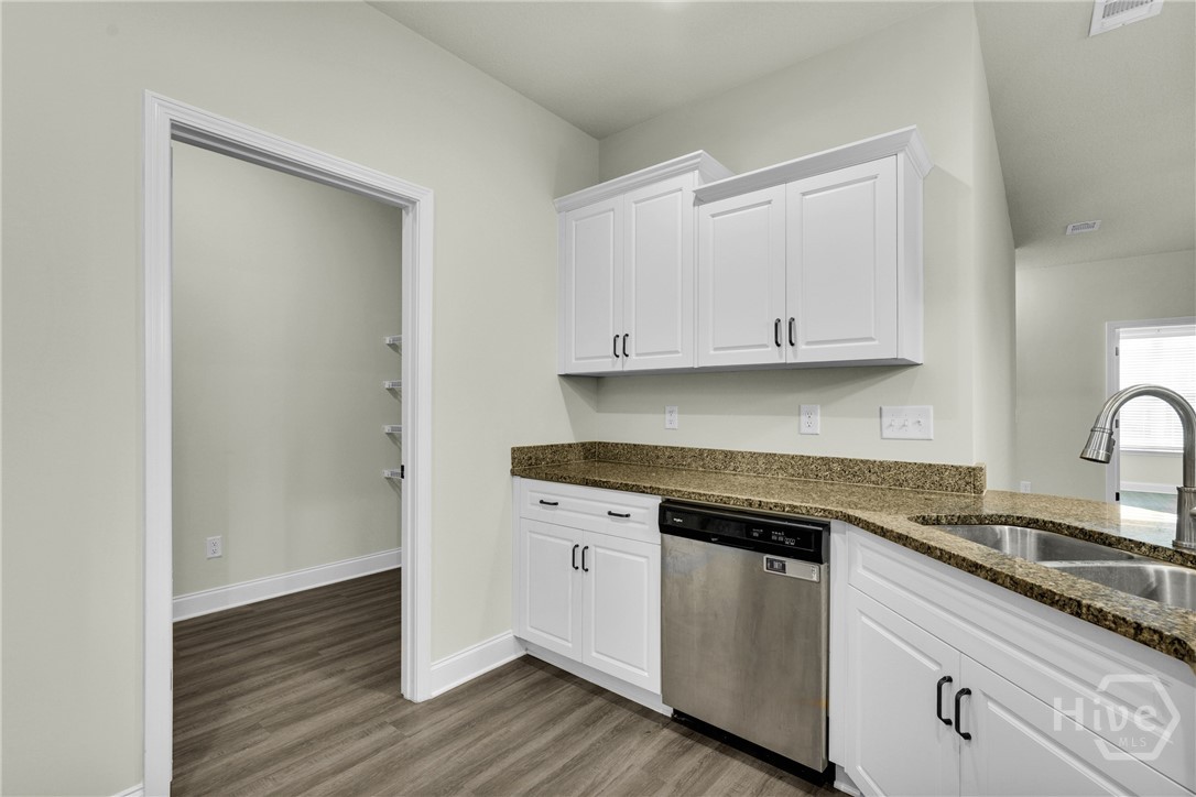 Efficient kitchen plan with tons of storage in lau