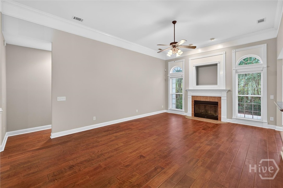 Family room with view of hallway to primary suite