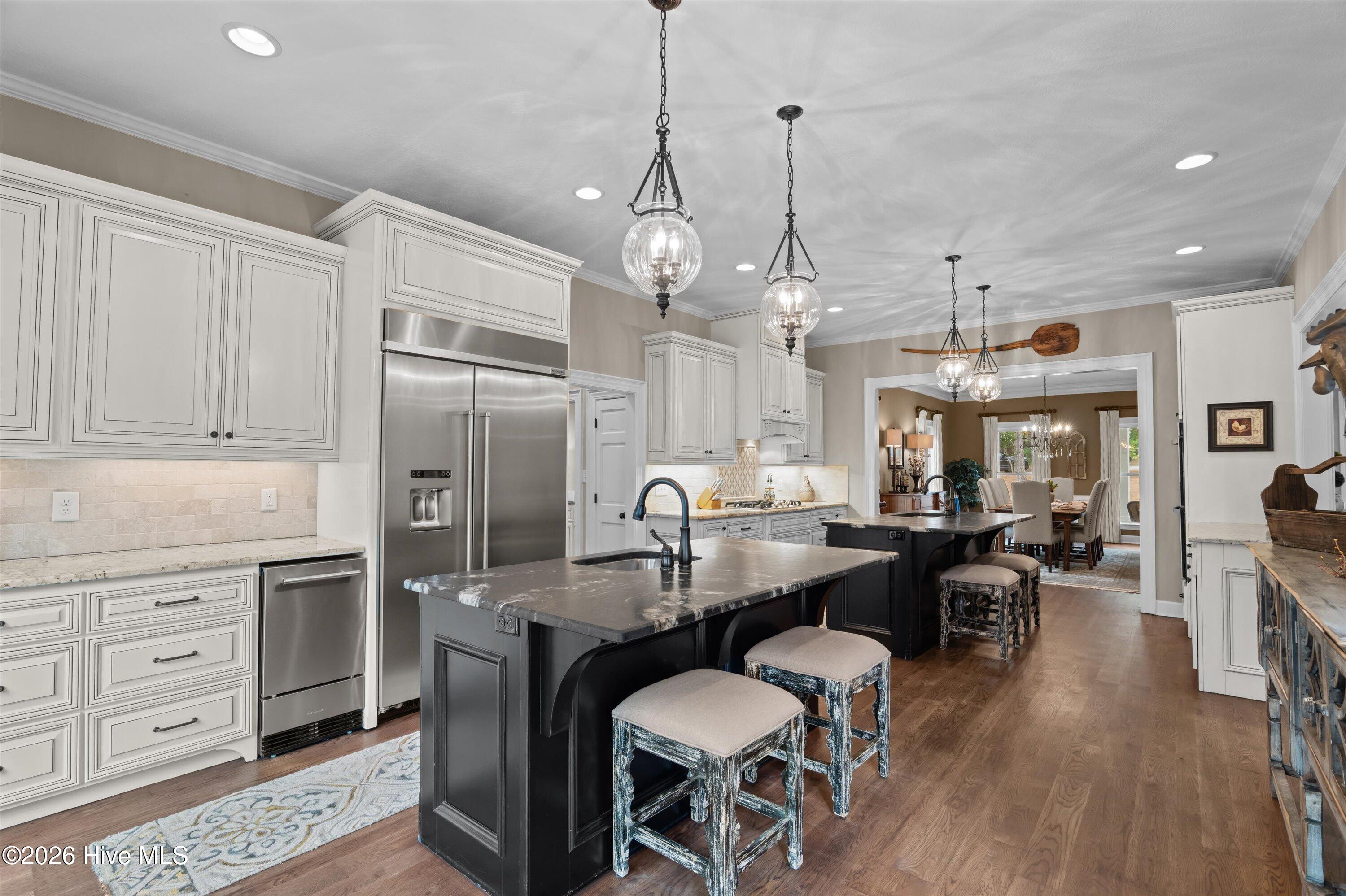 Incredible chef's kitchen with 2 islands, gas cooktop, double oven, and ice machine.