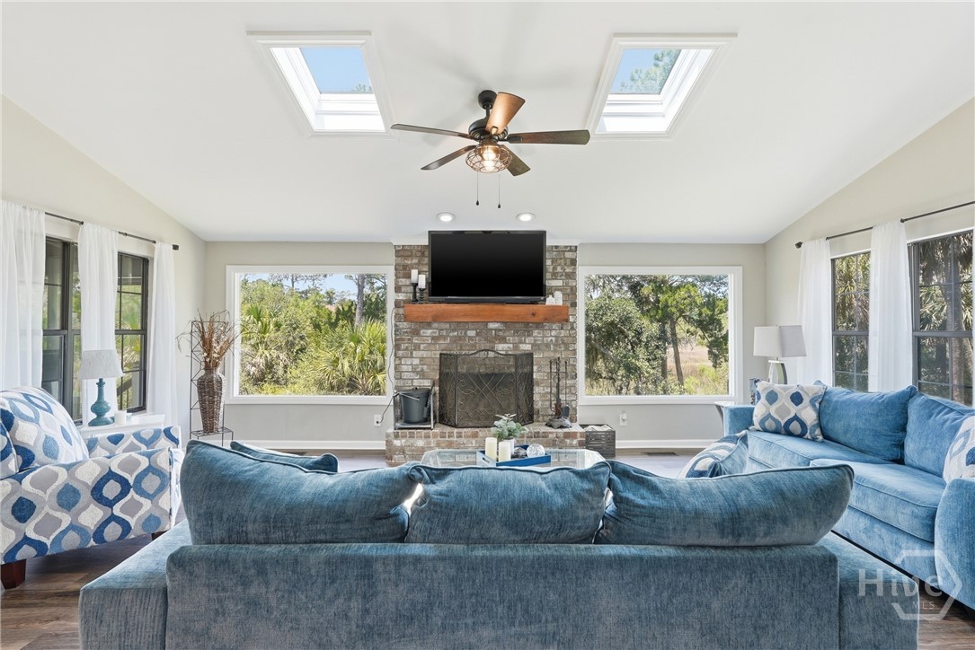Plenty of natural light in the Family Room with wood burning fire place