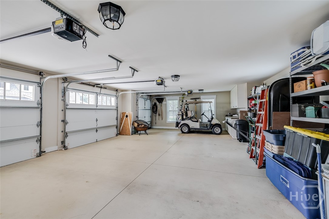 Large garage with cabinetry