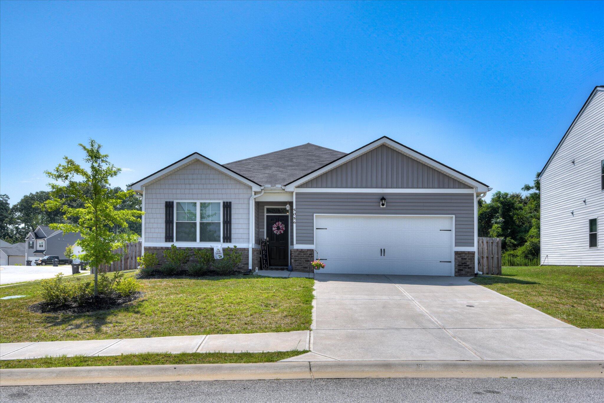 Motivated Seller! Willing to consider concessions with acceptable offer! If you are looking for a ranch close to Fort Gordon in beautiful Grovetown, Georgia? This is it! Corner Lot in Captain's Corner is centrally located between Gate 1 & 6. Need a huge fenced-in back yard with two gates? This ranch design has a spacious family room that expands to a casual dining area. There is plenty of room for everyone to gather around the open island kitchen. The private bedroom suite features dual vanities, separate shower and luxurious garden tub. Secondary bedrooms offer oversized closets for extra storage. This 4-bedroom Cali floor plan is the perfect combination of open concept and split-floor plan. Soaring ceilings, laminate flooring, granite counter tops, and over-sized foyer greets you! This home is built with an industry leading suite of smart home products. Look no further!