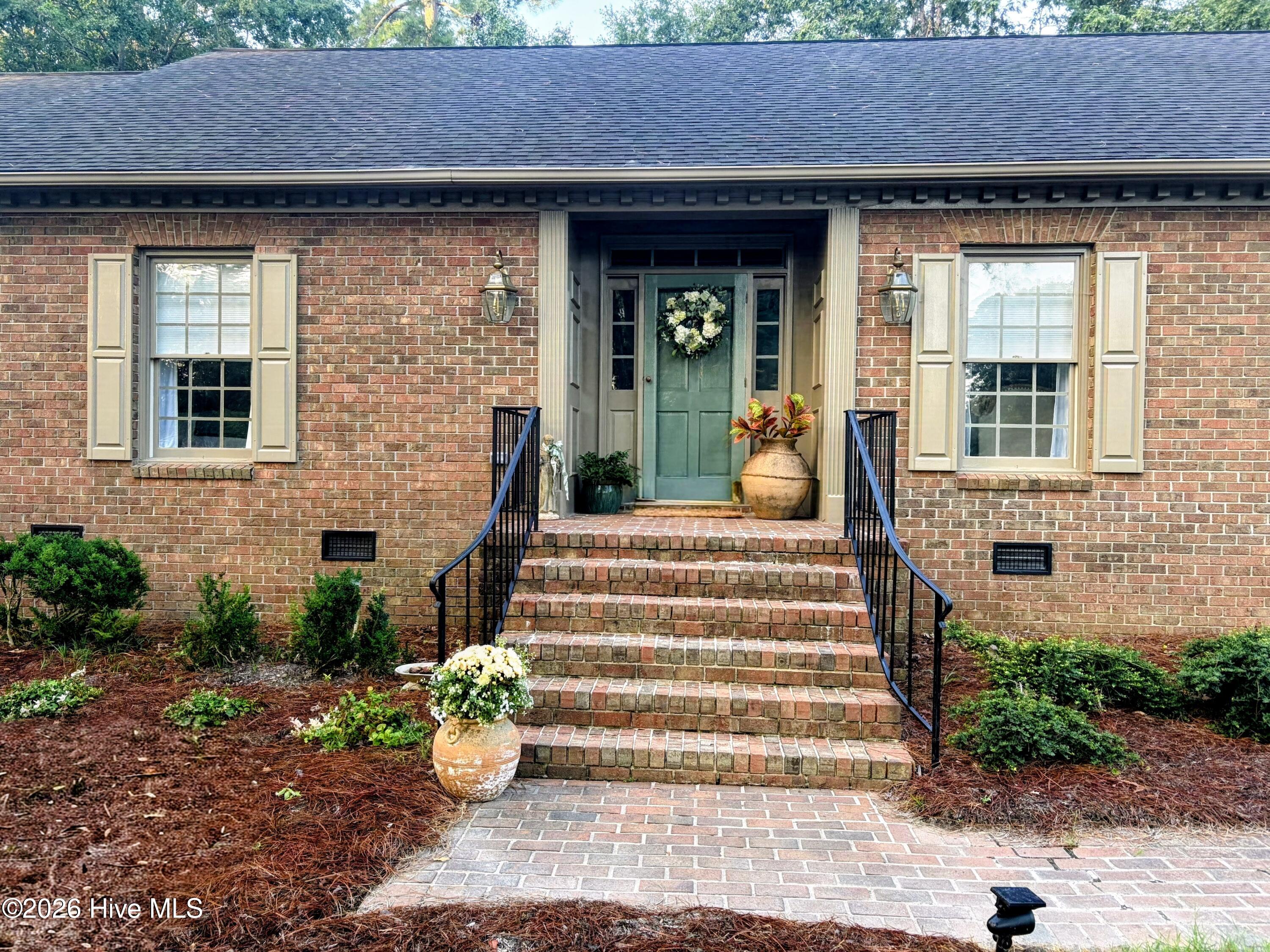 Fully renovated, professionally designed,  3081 sq ft brick ranch. Gorgeous new engineered white oak flooring and tile throughout. Very large rooms include all new huge kitchen, walk-in pantry, breathtaking living and dining rooms, large family room with masonry fireplace and adjacent walk-in bar, all new plumbing, all new bathrooms, new lighting throughout, sunroom perfect for enjoying sunsets, great workshop adjacent to two-car garage. Extensive new landscape plants, French drain system, rear deck overlooking #1 putting green. Words are not adequate so this one is a MUST-SEE!