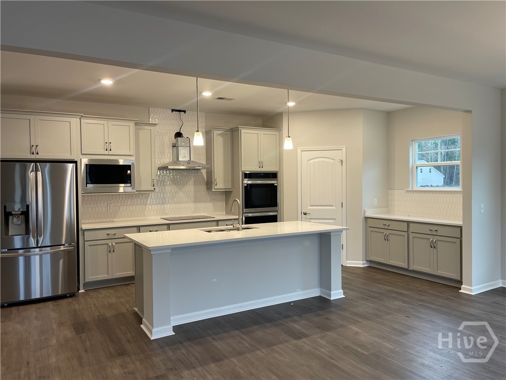 Tons of Cabinets, Double Ovens and Large Island
