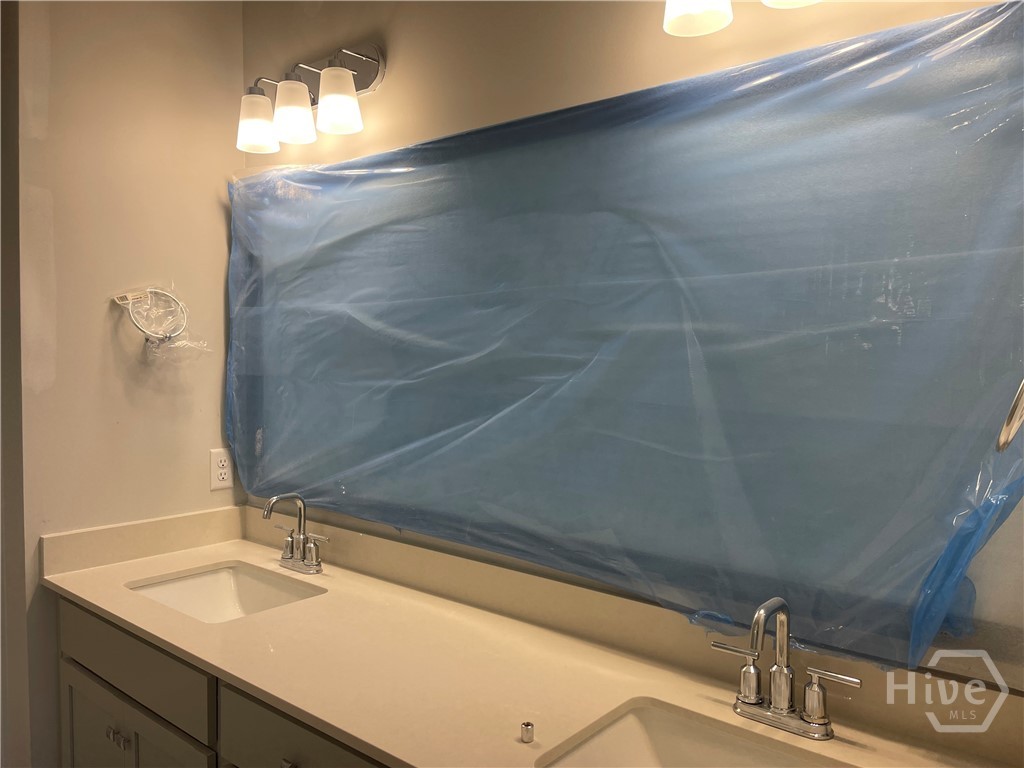 Double Vanity with QUartz Countertops in Primary