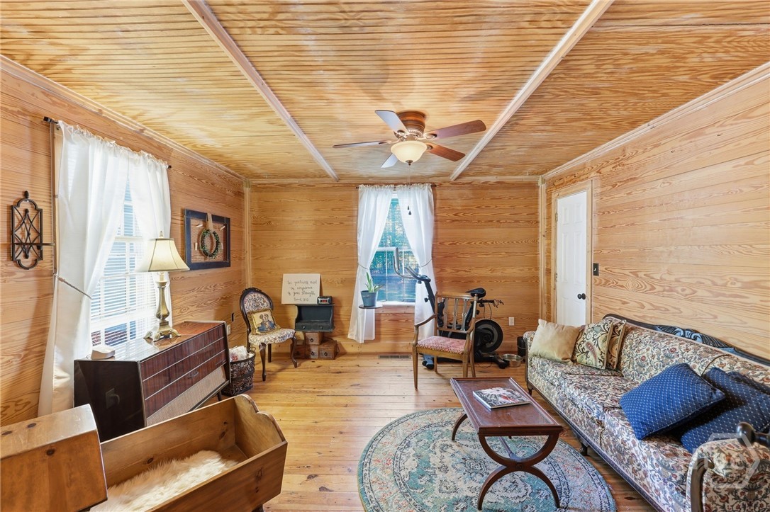 Formal living room or second downstairs bedroom with closets