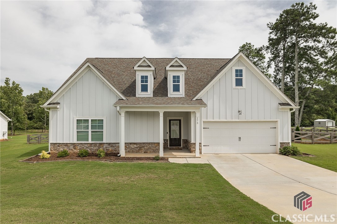 Welcome home to the Farms at Lakeside. This 4 bedroom 3 bathroom home features an open floor plan with a spacious living room, and a large kitchen island and dining area perfect for entertaining guests or gathering with family. The granite kitchen countertops and vinyl flooring create a low-maintenance simplicity to the space, while the plush carpeting makes the bedrooms cozy and inviting. The owner's suite on the main level connects the primary bath to an oversized walk-in closet and connects to the great laundry room. Two more bedrooms and a full bathroom on the main level and upstairs is a fourth bedroom and a full bathroom.The exterior of this home is just as impressive as the interior. The front of the house boasts a charming board and batten design, giving it a classic farmhouse feel. The sides and rear are finished with smooth concrete siding, ensuring durability and low maintenance. The home sits on a generous 1.56 acre lot, with the fenced-in backyard backing up to peaceful woods. If you're looking for the perfect blend of comfort and style, look no further.