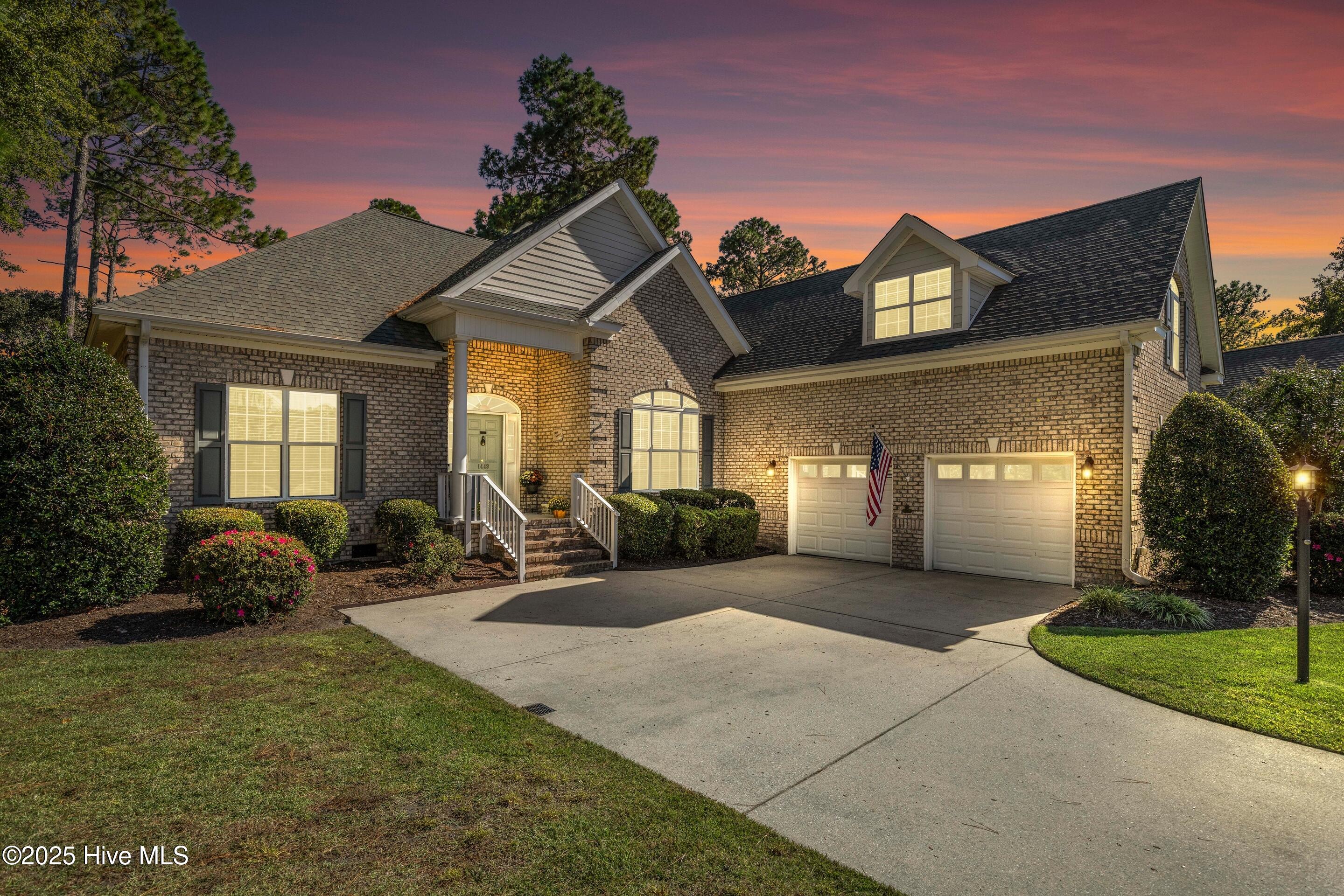 Step inside 1449 Turning Leaf and feel an immediate sense that this is the ONE—A place to call home.  The Grand Foyer gracefully welcomes you into the spacious Great Room, where a cozy corner fireplace sets the tone for relaxing evenings. The classic formal dining room draws the eye with its elegant design.  By evening a French Country chandelier casts a gentle glow, bringing warmth to every meal.  By day, sunlight bathes the space in natural light through elliptical arched windows.  The walls are artfully finished with wainscoting, chair rails, and crown molding for timeless appeal.  The Home Chef's Kitchen features a 5-burner gas cooktop with a tile backsplash and medallion focal point. Stainless steel appliances include a wall oven and microwave. Cherry cabinetry and granite counters provide ample storage and workspace, while a corner glass cupboard is perfect for displaying your favorite collectibles.  Picture yourself unwinding in the Carolina glass-enclosed retreat. Curl up with a book or simply take in views of the tranquil backyard.  Property is 0.42 acres of manicured landscaping that provides that peaceful feeling of pride in ownership.  The main floor primary bedroom suite is a sanctuary, featuring a tray ceiling and paddle fan that evokes the charm of CasaBlanca.  Surrender the day and pamper yourself in a spa-like soaking tub. Two cheerful guest rooms share a bright, well-appointed full bathroom.  The finished room over the garage is a versatile hideaway with its own full bathroom, ideal as an additional bedroom or home office.  Recent updates include 2023 installation of fortified roof and HVAC system ensuring comfort and peace of mind.  Reflective radiant insulated sheathing keeps the walk-in attic comfortable.  A side-facing two-car garage adds to the charm and curb appeal.  Imagine spending your mornings and evenings enjoying every carefully crafted detail of this inviting home.  Schedule your private tour today - tomorrow may be too late. Location and Community FeaturesWinding River offers an exceptional coastal lifestyle, just 40 minutes south of Wilmington, one hour north of Myrtle Beach airport, and minutes from the historic seaport town of Southport. Residents enjoy exclusive access to a private oceanfront Beach Club and pool on serene Holden Beach. Boaters benefit from two marinas, one on the Intracoastal Waterway and another at the "River House" Clubhouse on the Lockwood Folly Riverproviding the unique opportunity to travel to the Beach Club by boat.  Community amenities include a Property Owners Clubhouse and Event Center, Poolside Pavilion with B.Y.O.B. bar, picnic, and grilling areas. Outdoor enthusiasts can enjoy the Carolina National Fred Couples 27-hole Audubon golf course, fitness center, walking trails, tennis, pickleball, bocce ball, and a community garden. Vibrant days and welcoming evenings make Winding River a place where neighbors connect and thrive in a coastal paradise.