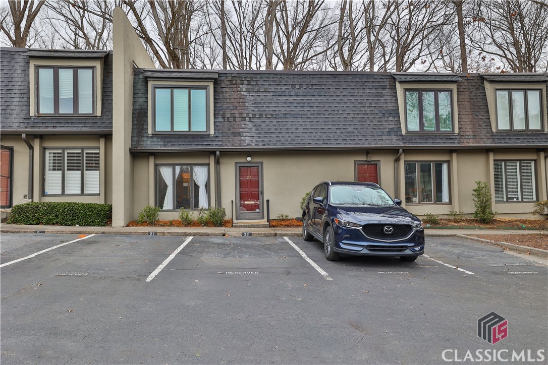 This stunning home is in the desired community of the Ivy's in Buckhead, just steps from everything! This will not last long and it has been lovingly cared for and renovated. No detail was spared! The kitchen is a show stopper with beautiful white cabinets/granite countertops, stainless appliance/stainless under mount sink.The large living room leads to a private and fenced-in rear patio; the patio is backed by a wooded area, providing complete privacy to the rear. The upstairs features two spacious bedrooms and beautiful renovated bathrooms. This home has tons of natural light and no carpet!! Both second floor windows are brand new. All you have to do is move in and enjoy the amazing community at Ivy Gates off of Roswell Road that offers a pool and tennis courts. You are walking distance to Superica, Hals, Cava, all shopping and Chastain Park!