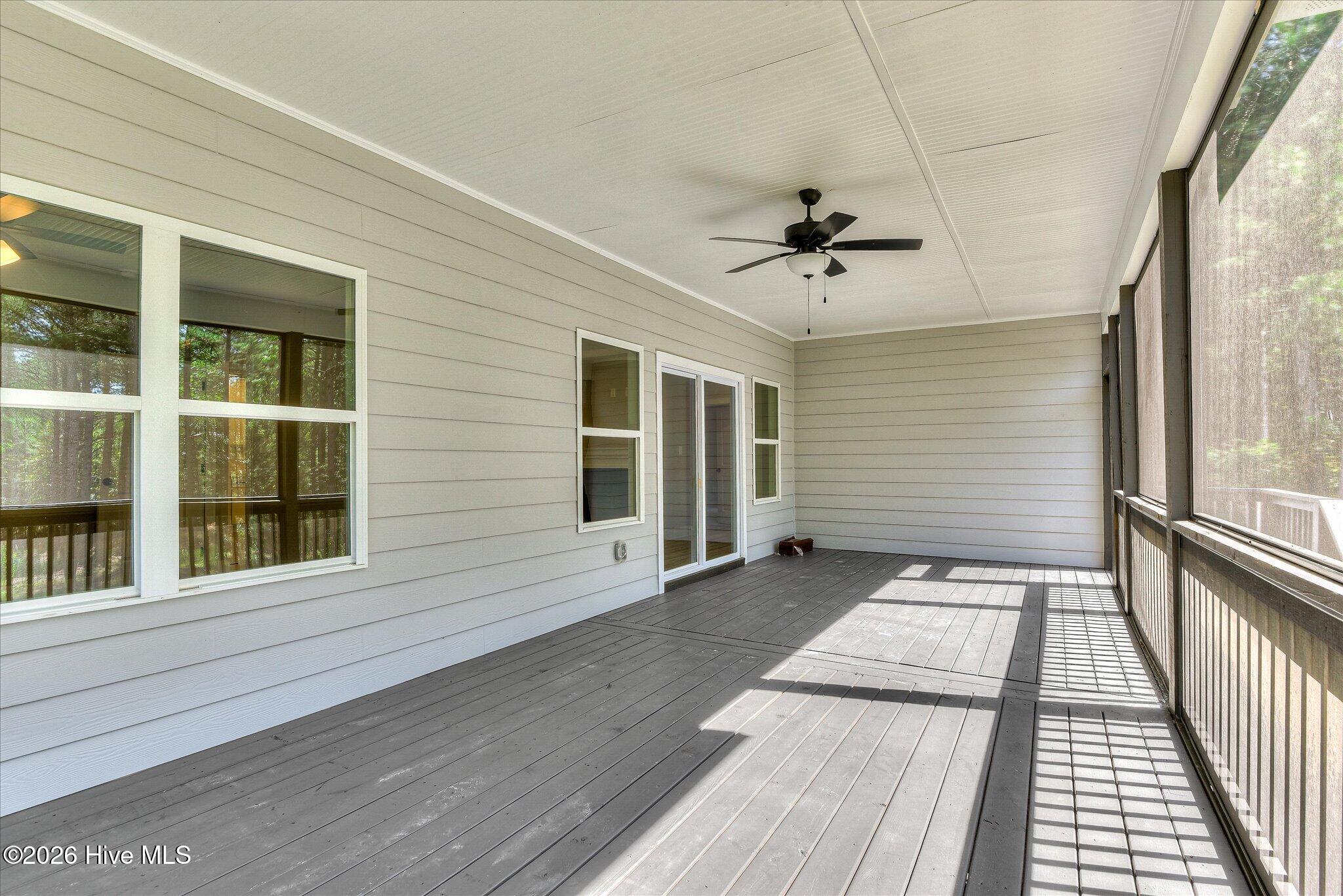 Screened porch stretches across the back of the home.