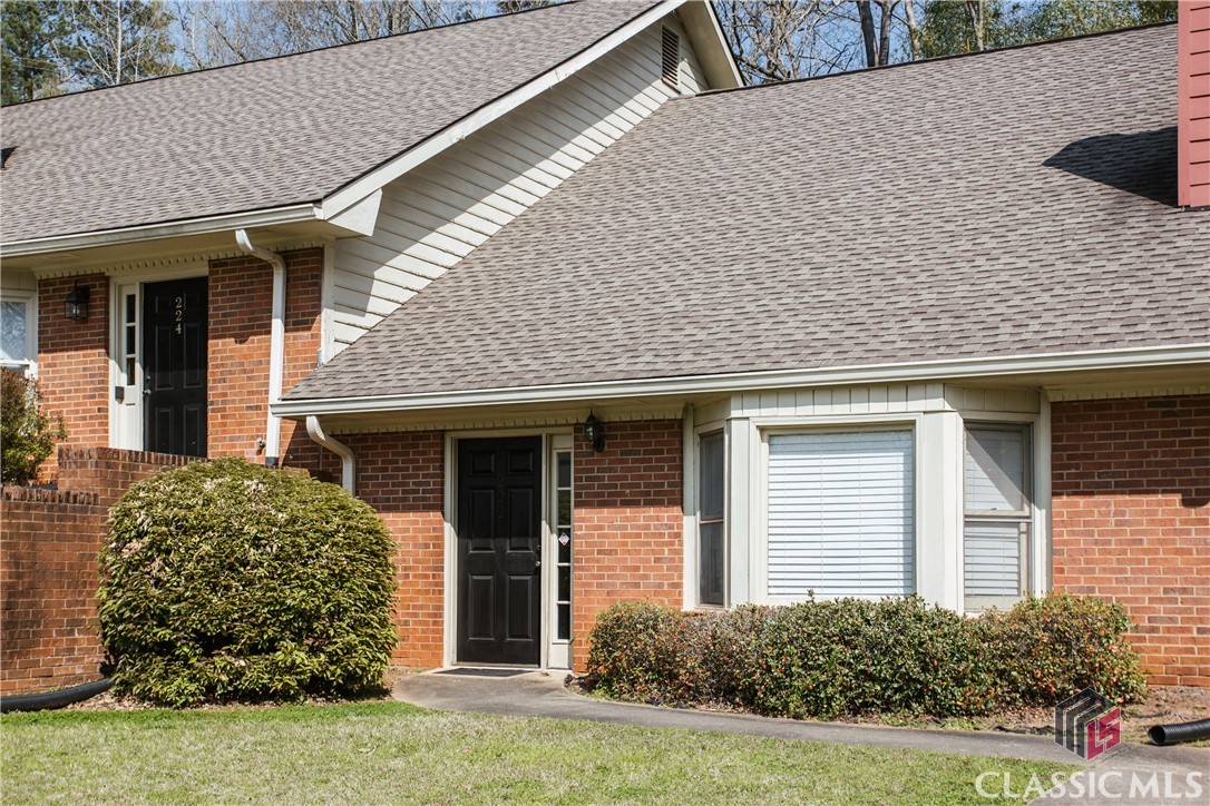 This solid, all brick condo presents an excellent opportunity for investment, for student-living or as a personal residence right in the heart of Athens.  It sits just minutes to Five Points, Beechwood, Downtown or UGA's campus and has convenient access to the Loop.  The generously sized living room features a vaulted ceiling, wood-burning fireplace, a built-in bookshelf, and low-maintenance, durable tile flooring which seamlessly extends throughout the main level.  The kitchen is open to a dining area and features a brick floor with white cabinets and granite countertops.  With a perfect area for grilling and entertaining out back, a private, fenced patio is accessed from the kitchen.  A large bedroom is conveniently situated on the main level with access to a full bathroom.  This primary bedroom features two large closets and French doors to the patio. Upstairs are two large bedrooms and an additional full bathroom.  Continuing with easy maintenance and durability, there is laminate wood flooring throughout the landing, the hallway and through the bedrooms upstairs!  Both of the bathrooms have updated vanities, tile floors and tub/shower combos.  Don’t miss your chance on this three bedroom condo in Eaglewood Court!