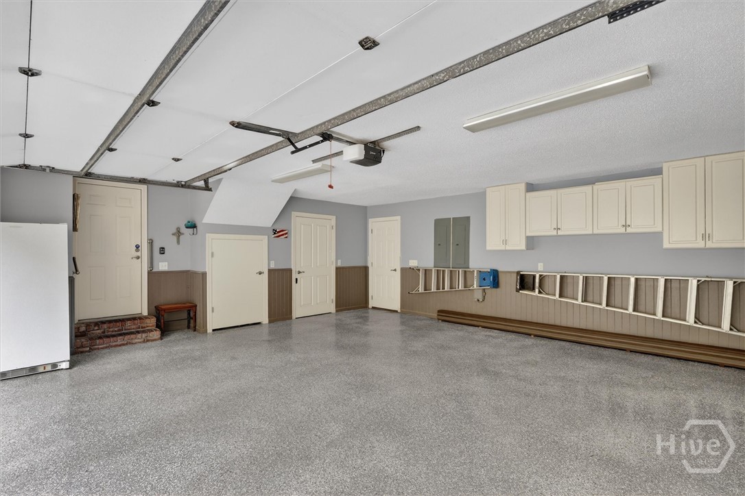 Two car garage with epoxy floor and two storage cl