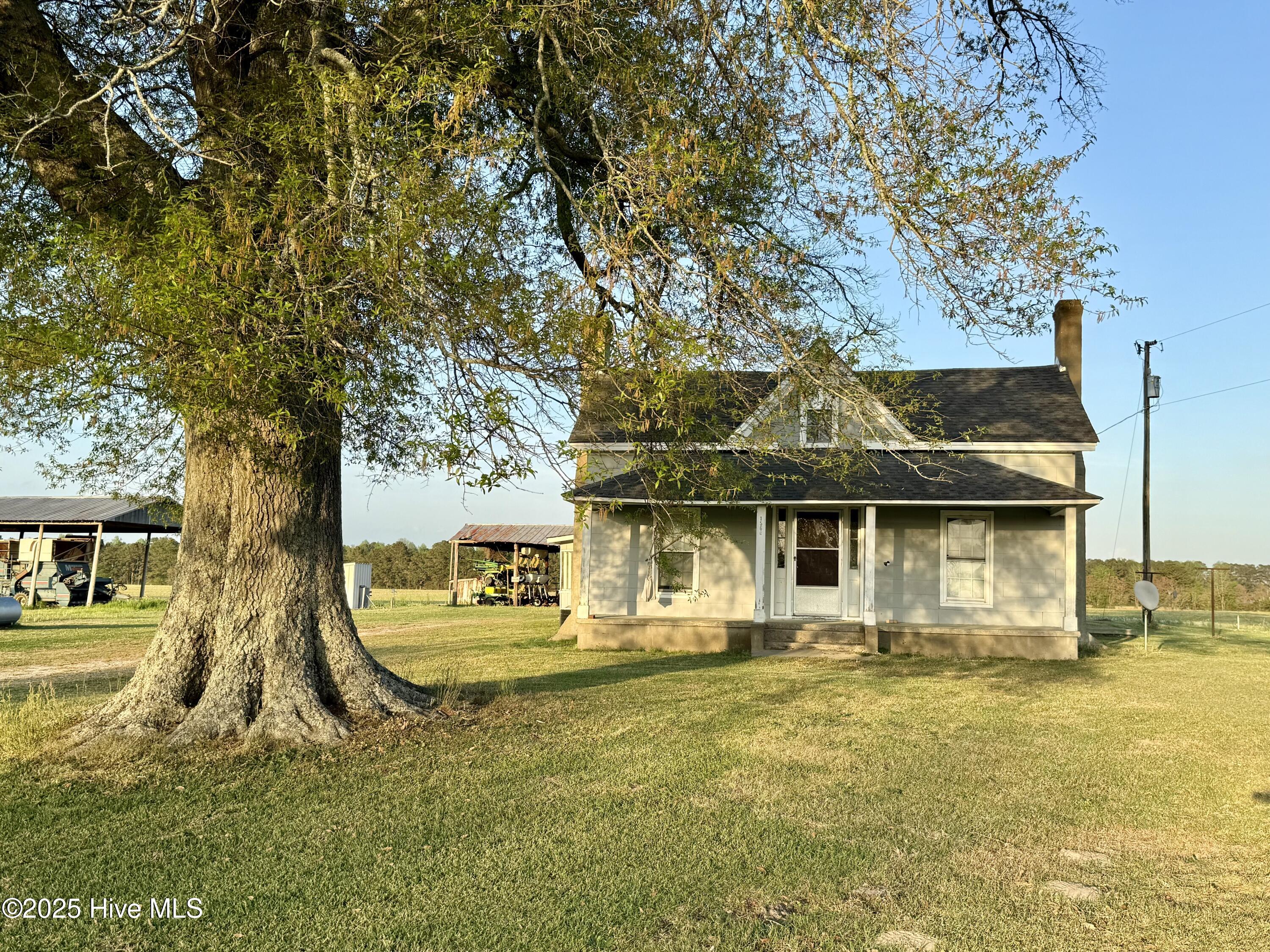 Discover the perfect blend of country charm and timeless character in this delightful farmhouse, brimming with potential. Built in the early 1900s, this 3-bedroom, 1-bathroom home offers a warm, inviting atmosphere ready to be transformed into your dream retreat.
Step inside through the double patio deck doors at the rear entrance and be greeted by a spacious living area, seamlessly connected to the kitchen—ideal for family gatherings or quiet evenings at home. The property also features a generously sized laundry room and a large attic, perfect for all your storage needs.
Outside, you'll find a charming front porch where you can relax and enjoy serene sunsets, an enclosed side porch brimming with possibilities, and a wood deck at the back, perfect for outdoor entertaining. While the home is in need of some TLC, it offers endless potential to create a peaceful haven tailored to your vision.
Situated just outside the quaint town of Bear Grass, this is your chance to own a piece of history and embrace the tranquility of rural living. Don't let this opportunity pass you by!