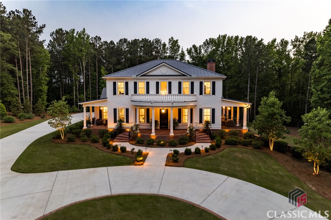 Welcome to 1788 Wild Azalea Lane, a stunning estate located in the highly desirable Crystal Hills development. Situated on an expansive 5.22 acre lot, this luxurious residence offers an unparalleled combination of elegant design, impeccable craftsmanship, and a serene natural setting. With 5 bedrooms, 6 1/2 bathrooms, and an array of exceptional features, this home is sure to captivate the most discriminating of buyers!As you step inside, you'll be greeted by a grand foyer that sets the tone for the rest of the house. The interior boasts a seamless blend of modern amenities and timeless charm, with high-end finishes and attention to detail evident throughout. White Oak floors span the entire home with the exception of the basement media room. The spacious kitchen is a chef's dream, featuring custom built-ins, exquisite countertops, an oversized butler's pantry, and ample storage space. Professional grade appliances include a 6 eye Wolfe gas range, paneled Thermador full size refrigerator and freezer, trash compactor, ice maker and the ever convenient pot filler. This space provides the perfect setting for preparing gourmet meals and entertaining guests with ease, as the graciously sized informal dining room is open to the kitchen.  The main floor of the house hosts a sizable great room with a gas log fireplace, a stunning dry bar with a mirrored backsplash and two french doors leading to a covered side patio. Additionally, the main level is home to a private guest suite with access to a large side patio, and a magnificent master suite, offering a peaceful retreat from the hustle and bustle of daily life! The master bedroom is generously sized and provides a serene ambiance with access to a private covered patio, while the master bathroom is a true oasis, complete with a luxurious soaking tub and a separate shower. It's a perfect place to unwind and rejuvenate after a long day!  Choose from one of two stairwells to access the upper level which has three oversized bedrooms, all with en suite baths, and a second laundry room. One of the guest suites boasts a wall of cabinetry and mini fridge for early risers!This remarkable property also includes a finished basement featuring a home gym (or 6th bedroom), a full bathroom with a tub/shower combo and a media room. The unfinished basement space offers endless possibilities for entertainment and leisure which is currently being used as a turf soccer training room and a large room stubbed for an additional fireplace and rec room.  Whether you're looking to stay active or relax with your favorite movie, you'll find the ideal space to do so. Last, but certainly not least, is the outdoor oasis, just a few steps off of the back door, providing the perfect setting for hosting summer gatherings or simply enjoying the tranquility of the surrounding nature!  The large heated pool is accented by two tanning ledges flanking the spa, and a vaulted open air pool house with a brick hearth fireplace, and a fully equipped kitchen for ease of cooking! A half bath is also located in the pool house.Located in Oconee County, this home provides a peaceful and private escape, while still being within easy reach of nearby amenities and conveniences. From its beautifully landscaped grounds to its thoughtfully designed interiors, every aspect of this residence has been meticulously crafted to provide a luxurious and comfortable lifestyle.Don't miss your chance to own this exceptional property at 1788 Wild Azalea Lane. Schedule a showing today and experience the epitome of luxury living in Athens, Georgia.