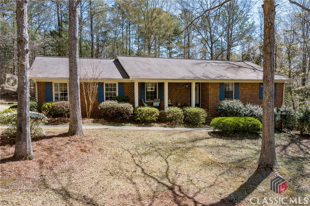 Located in the desirable Holly Hills neighborhood, this beautifully updated brick ranch offers both charm and functionality. Featuring 3 bedrooms and 2 bathrooms, the home is move-in ready with impressive upgrades throughout.As you enter, you'll find a dedicated dining space and a welcoming family room complete with a beautiful brick fireplace, perfect for cozy evenings. The completely remodeled kitchen includes an eat-in area and modern finishes, ideal for both everyday meals and entertaining.The large, renovated laundry room offers plenty of space for storage and organization, while the 2-car garage adds convenience and additional functionality.Step outside to the brand-new deck, where you’ll enjoy peaceful views of the expansive wooded backyard, which backs up to a protected buffer zone for added privacy and tranquility.Situated on a quiet cul-de-sac, this home combines a private setting with easy access to shopping, dining, and workplaces in Athens and Oconee. xx