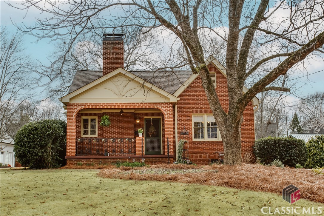Perfectly situated, precious brick bungalow that has been lovingly maintained and restored. There is a welcoming front porch with arched brick openings and reclaimed historic iron railing that leads into a living room with wood-burning fireplace. The dining room will comfortably seat 8 with views to the front and side yards. The kitchen was fully updated with custom Weber-Coleman cabinetry with lots of built-in nooks, quartz countertops, 6-burner dual fuel range, cabinet depth refrigerator, and plenty of wine and pantry storage. There is a laundry room with plenty of storage off the kitchen as well as a door to the side / rear of the home for ease of bringing in groceries. There are two bedrooms that share a hall bathroom that has been restored to preserve the original while making it fully functional. The owner's suite has a beautiful addition with a large bathroom with soaking tub, separate shower, double vanity, and large walk-in closets. With a full set of walk up stairs to the attic space, there is great additional storage and room for expansion. In the rear of the home is a precious patio perfectly lit for fire pits and dinner parties. All major systems have been updated including roof, HVAC, wiring, landscaping / irrigation, driveway, air and water purifiers, and more. There is no better location in Five Points with an easy walk to all of the restaurants, coffee shops and bakeries, nightlife, school, and UGA sporting events.